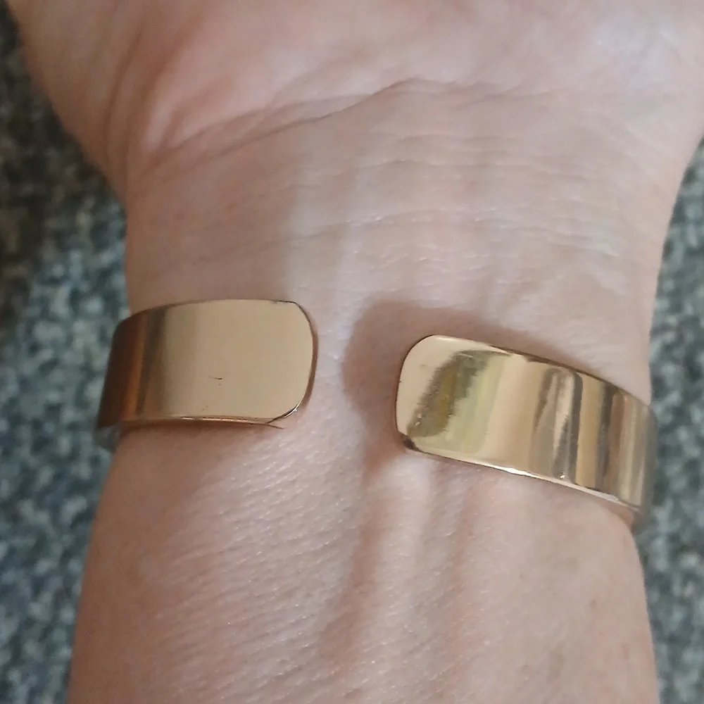 Peck & Peck rose gold tone with white face women's open cuff watch